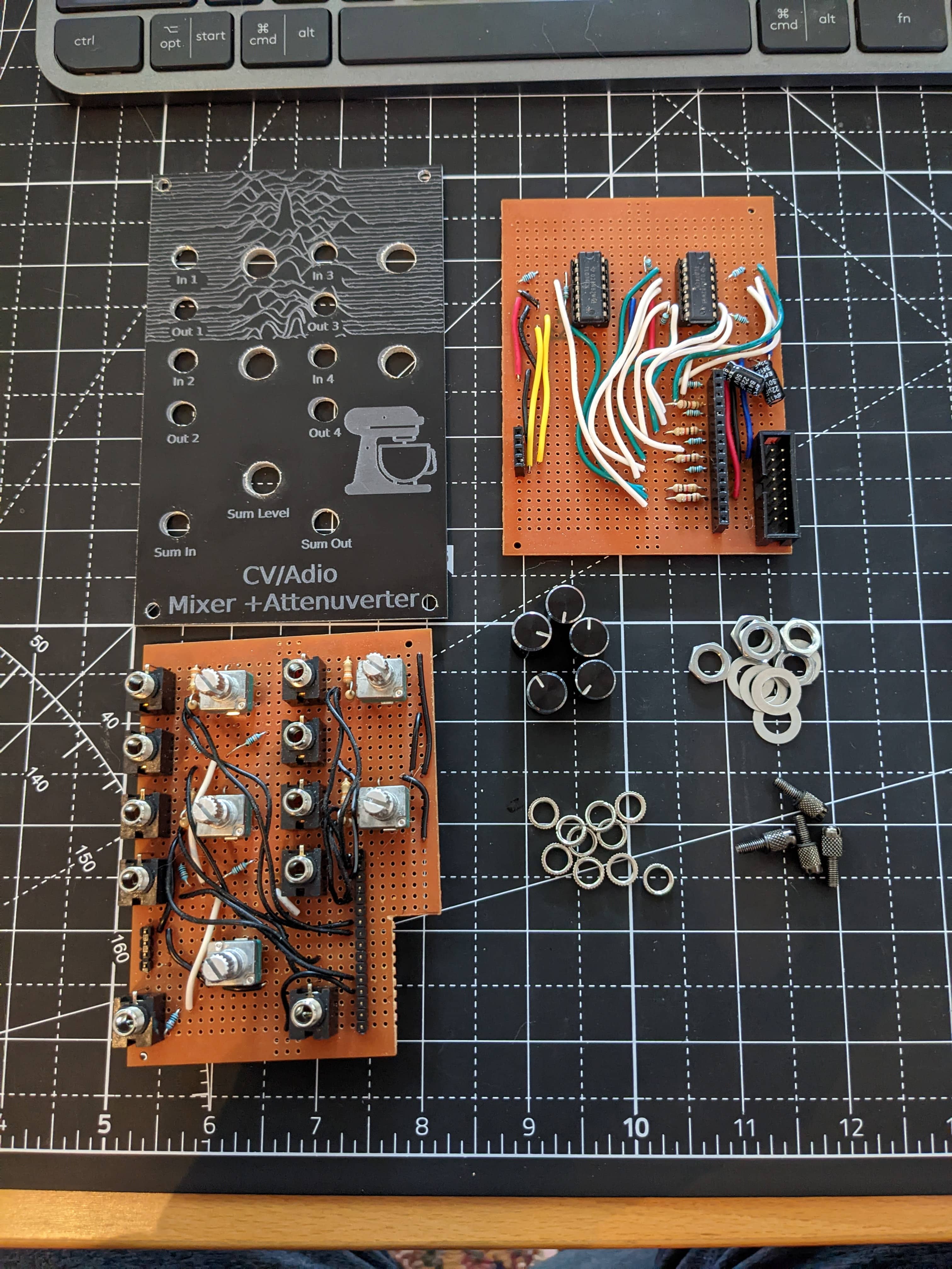 The Eurorack Breadboard Power module connected to a volt meter showing 23.8 volts